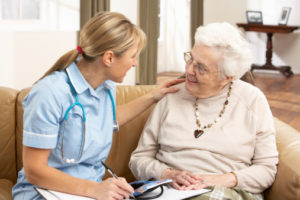 Home health aide with patient