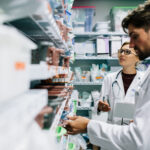 Pharmacy technicians working in a real world pharmacy