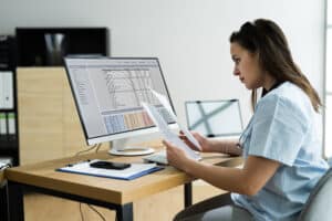 Nurse and man with blood pressure test in hospital for heart health or wellness.