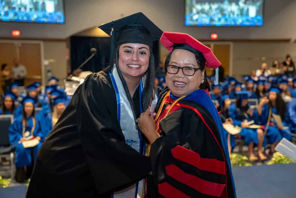 nursing director with graduating student