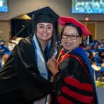 nursing director with graduating student