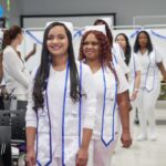 students walking down the aisle during pinning ceremony