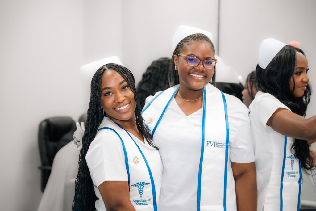 Two smiling FVI nurses after pinning ceremony