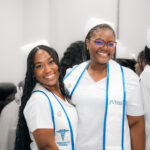 Two smiling FVI nurses after pinning ceremony