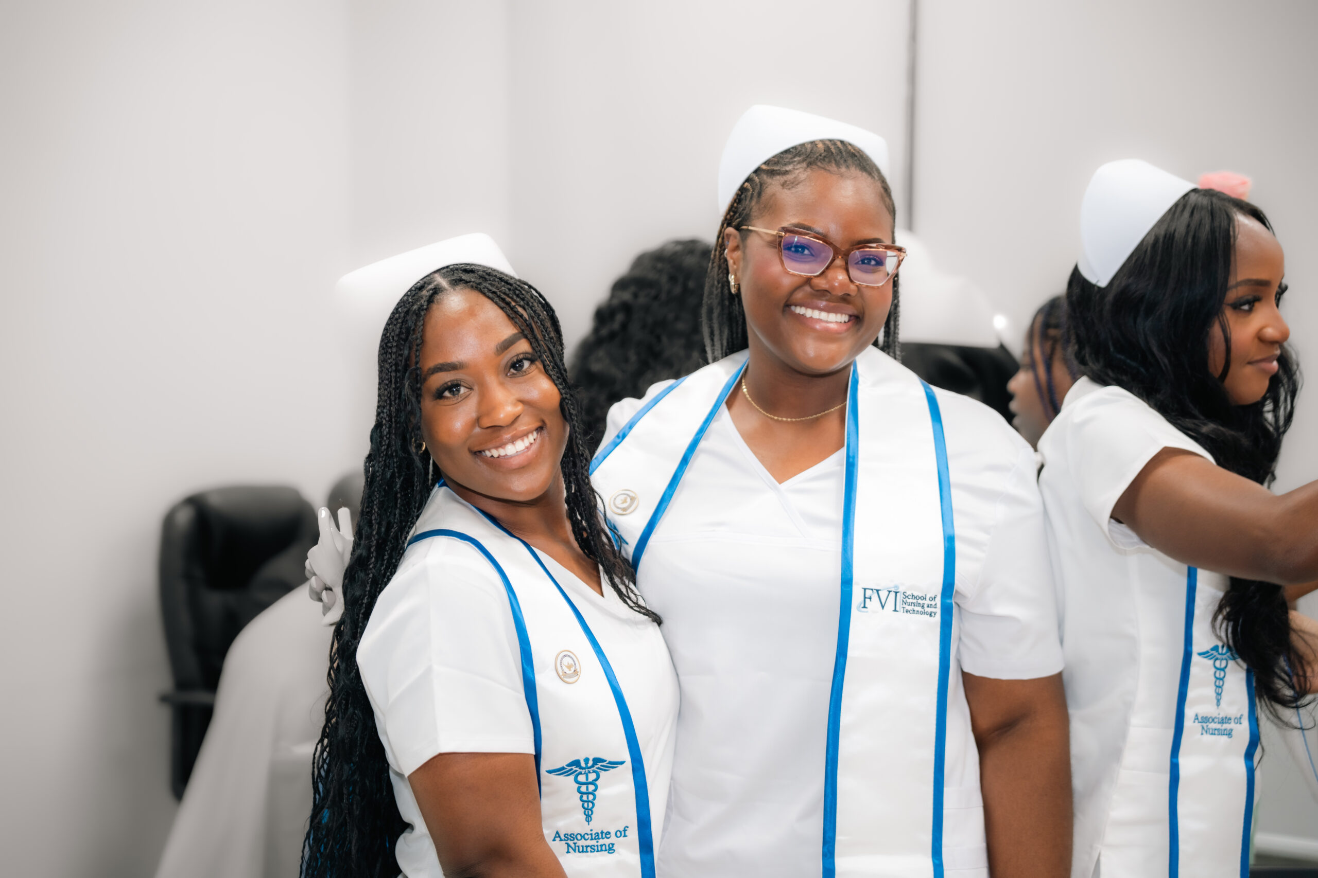 Two smiling FVI nurses after pinning ceremony 