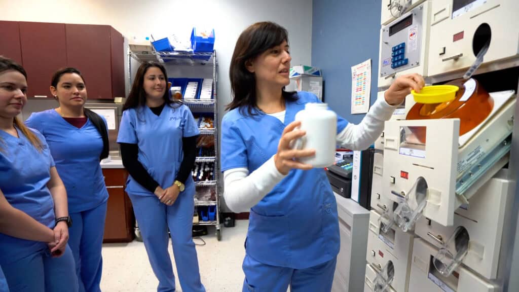pharmacy student practicing with other students
