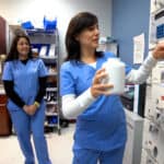 pharmacy student practicing with other students