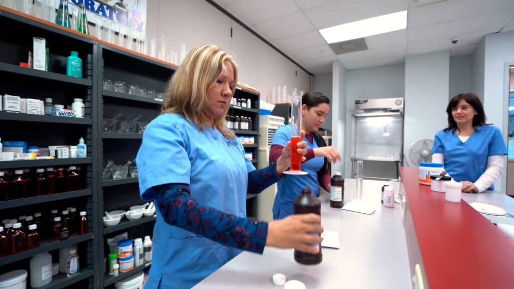 pharmacy student practicing at the pharmacy lab