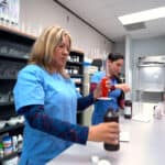 pharmacy student practicing at the pharmacy lab