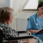 Woman nurse examining healthcare of retired patient