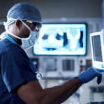 Vigilantly monitoring his patient's vitals