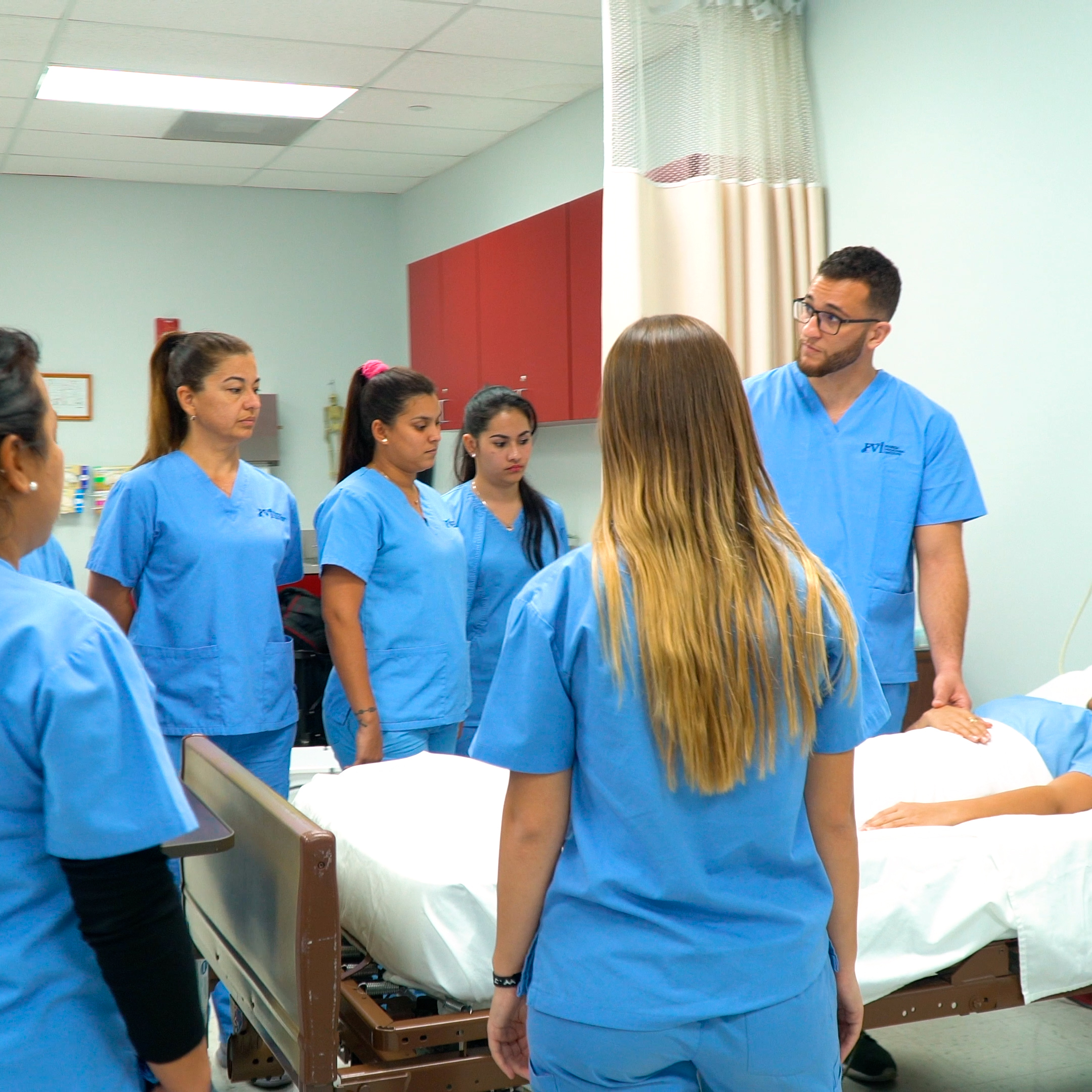 home health aide students practicing