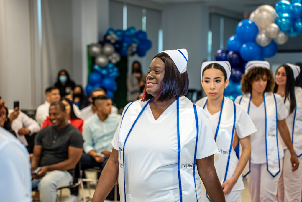 FVI nursing graduates walking into their Pinning Ceremony