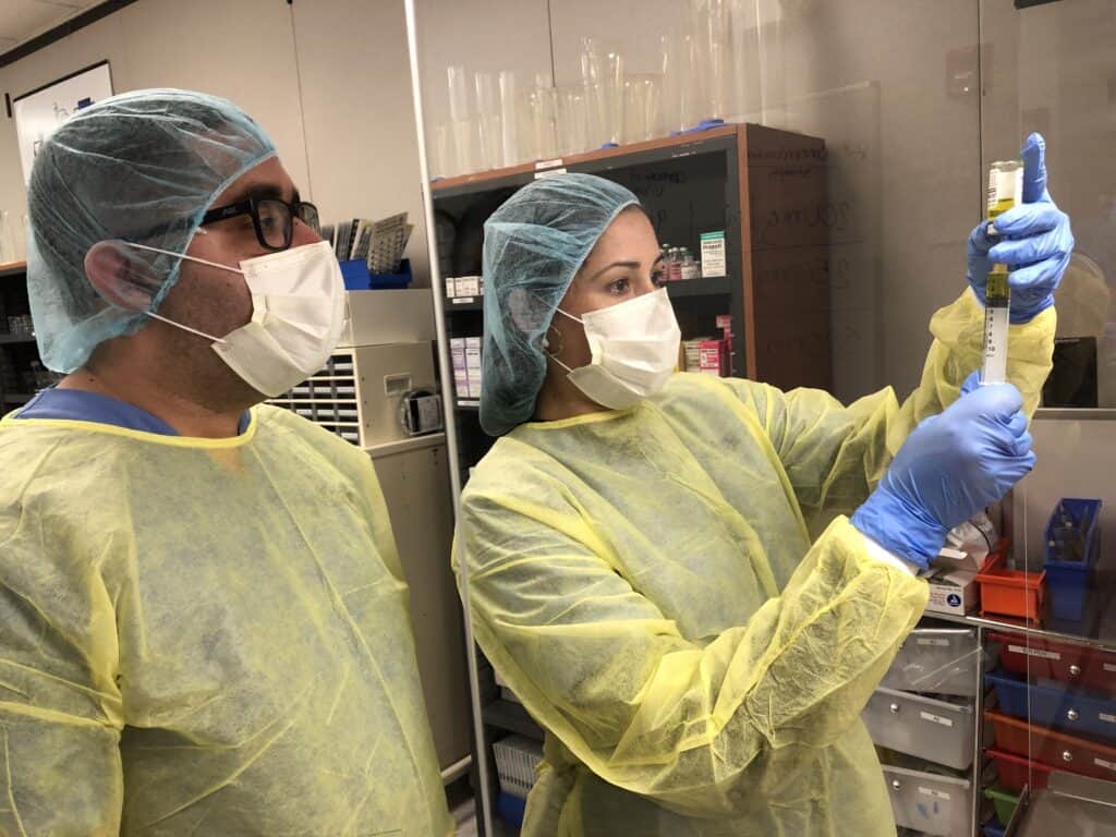 pharmacy tech student working with a syringe