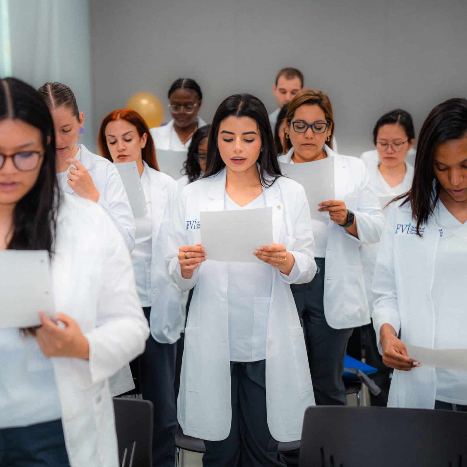FVI nursing students reading a pledge at a nursing orientation