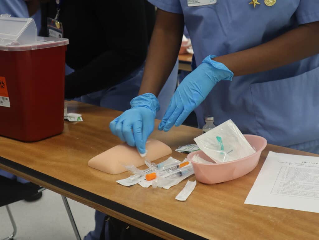 A student doing hands-on practice in class