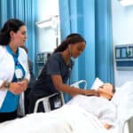 nursing student and instructor practicing