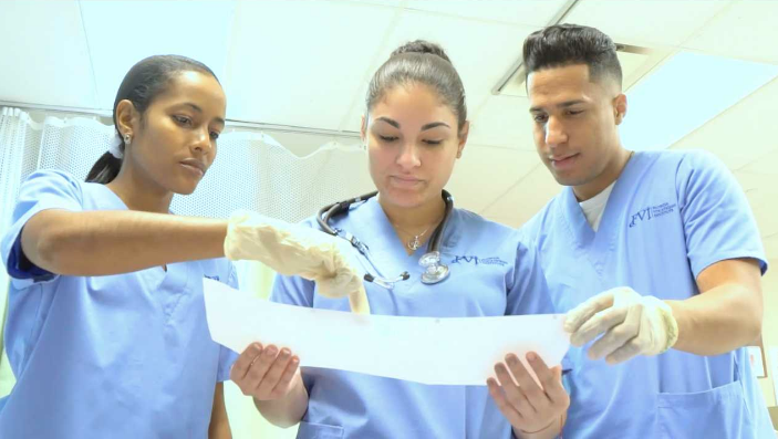 medical assistant students looking at EKG