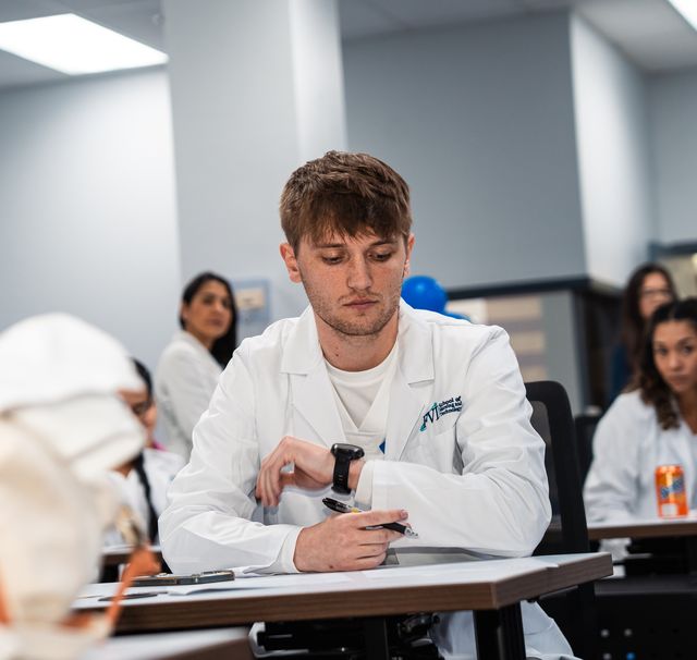 A student studies and prepares for the NCLEX in an FVI classroom