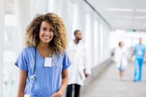 Nurse with ipad looking at the camera