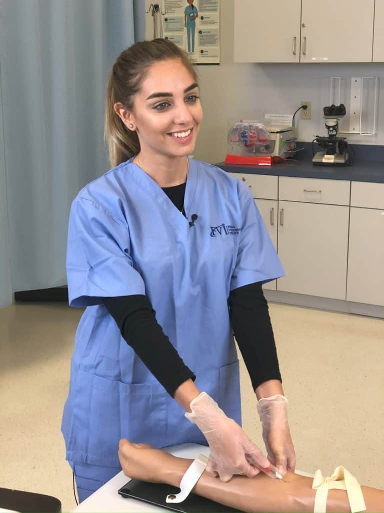 FVI Student - nursing program experiencing hands-on skills practice